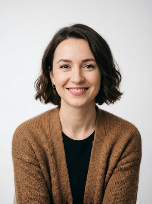 Professional studio headshot of a 30-year-old White Eastern European woman with a chin-length bob in