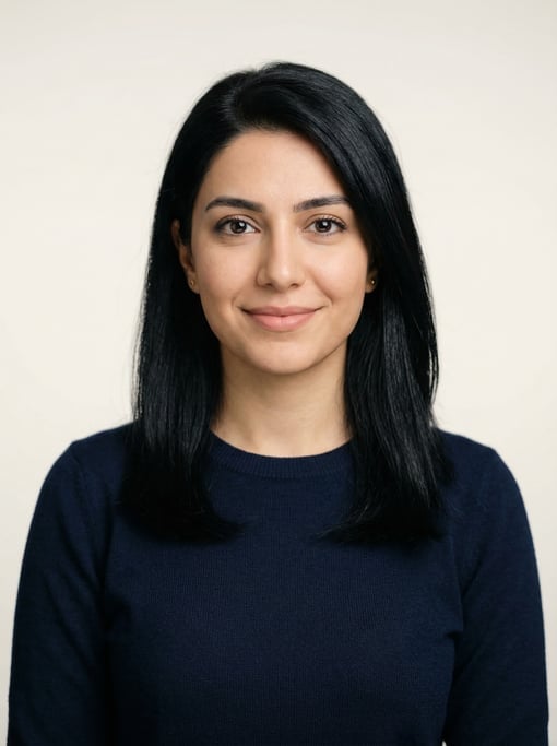 Professional studio headshot of a 25-year-old Persian woman with shoulder-length straight black hair