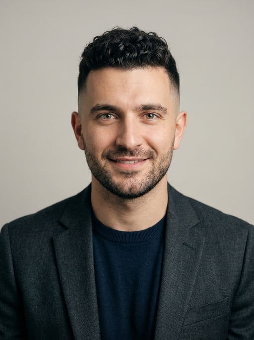 Professional studio headshot of a 27-year-old White Eastern European man with a skin fade with longe
