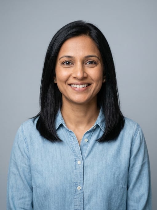 Professional studio headshot of a 40-year-old South Asian woman with shoulder-length straight black