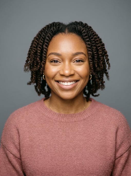 Professional studio headshot of a 24-year-old Nigerian woman with twist-outs in dark brown