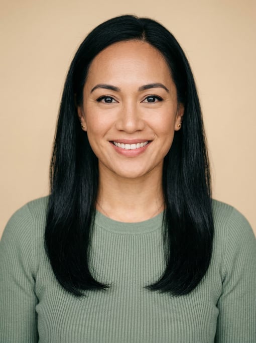 Professional studio headshot of a 32-year-old Pacific Islander woman with long straight black hair f