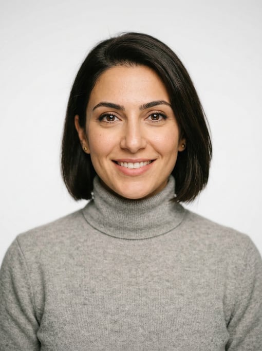 Professional studio headshot of a 31-year-old Lebanese woman with a chin-length bob in dark brown