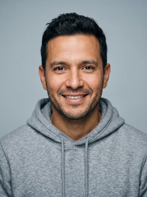 Professional studio headshot of a 38-year-old Colombian man with short textured black hair