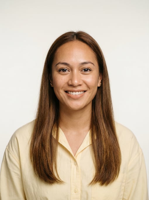 Professional studio headshot of a 24-year-old Polynesian woman with long straight chestnut hair