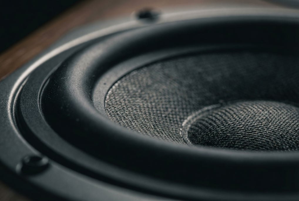 Macro photograph of a speaker cone driver at extreme close range