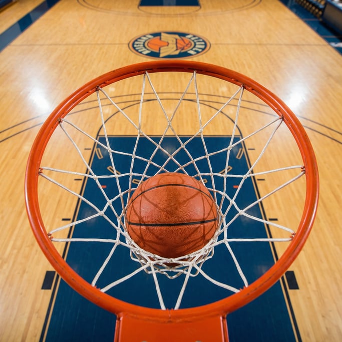 Overhead shot of a basketball going through a hoop and net from directly above