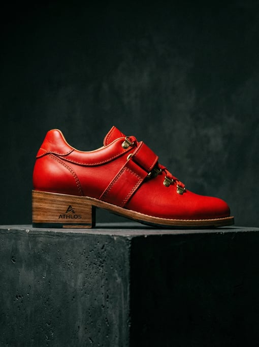 Single Olympic lifting shoe in bright red leather with a wooden heel
