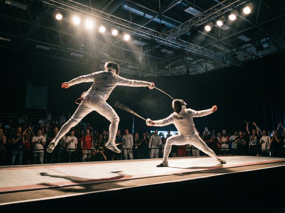 Two fencers in a bout, one executing a fleche attack, the other in parry, blades crossed