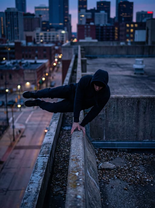 A parkour athlete mid-vault over a concrete barrier, urban skyline, frozen in perfect form (yya966qu)