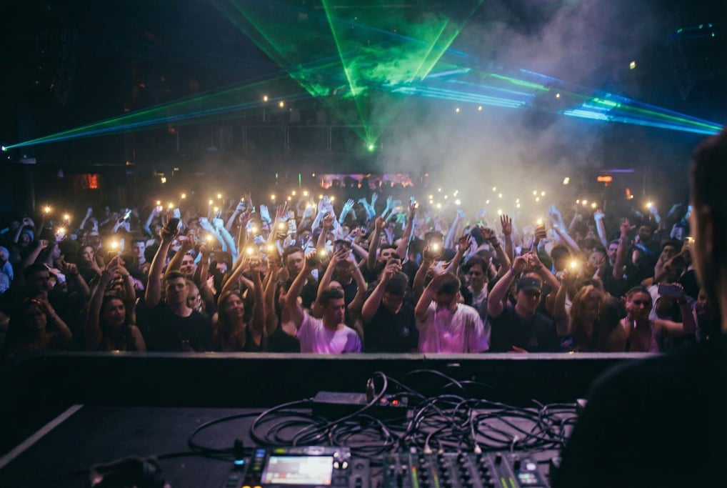 A nightclub crowd from the DJ's perspective looking out