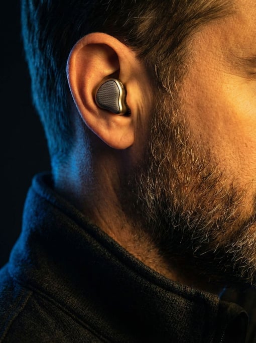 A man wearing concept audio-translating earpiece in his right ear