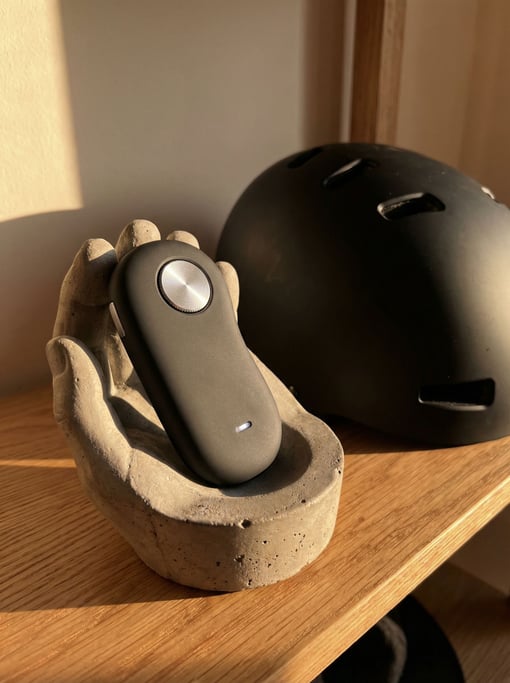 A concept electric skateboard remote in ergonomic pebble form