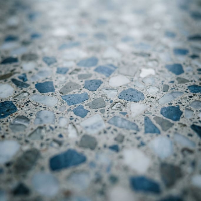 Terrazzo floor in macro, polished fragments of marble and glass in cement matrix