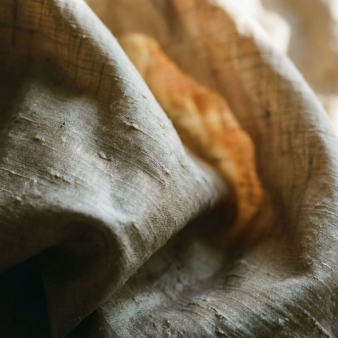 Extreme close-up of Raw silk fabric draped and catching side light (xxluvxwb)