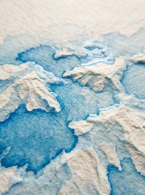 Cerulean blue watercolor pooling in the textured valleys of cold-press paper at extreme macro