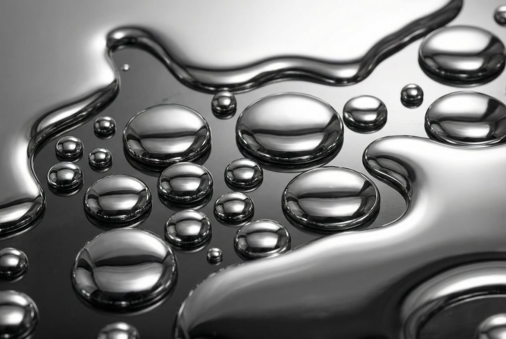 Liquid mercury pooling on a surface filling the frame