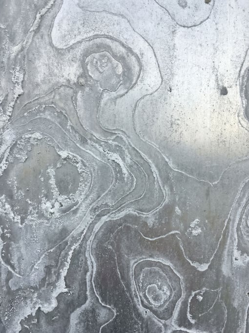 Corroded aluminum with white powdery oxide dominating the composition