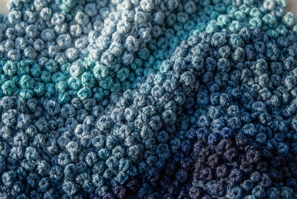 Dense French knot embroidery filling the frame