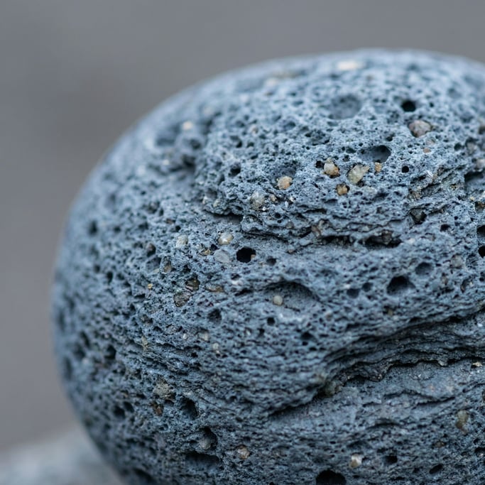 Volcanic pumice stone in macro, air pockets and mineral crystals in the porous surface (k9sel6t3)