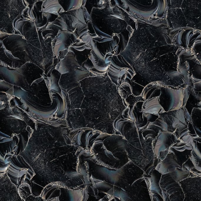 Seamless tileable texture of obsidian heavily worn and patinated