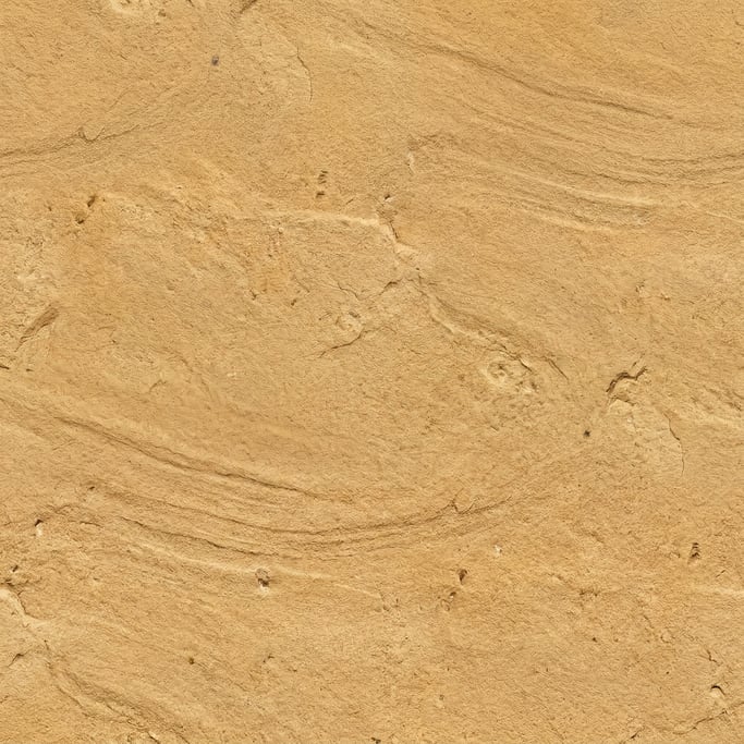 Seamless tileable texture of sandstone in honey gold lightly weathered and aged