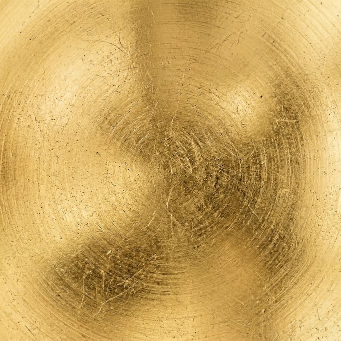 Seamless tileable texture of polished brass in extreme close-up showing micro-detail