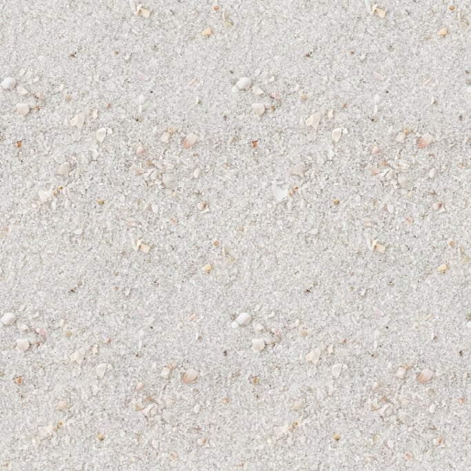 Seamless tileable texture of white beach sand in extreme close-up showing micro-detail