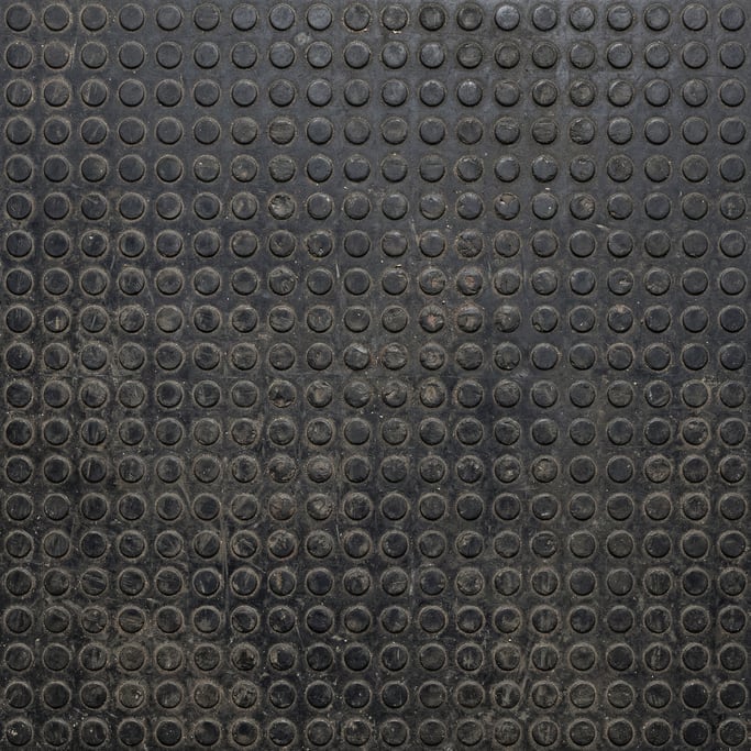 Seamless tileable texture of rubber mat heavily worn and patinated