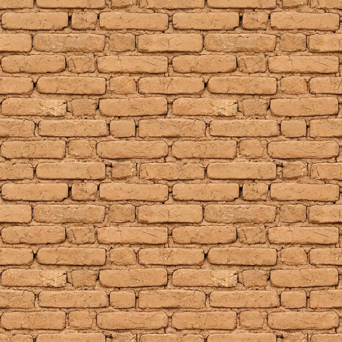 Seamless tileable texture of adobe wall lightly weathered and aged