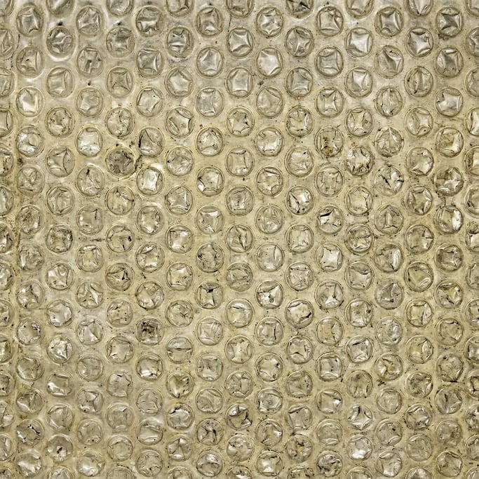 Seamless tileable texture of bubble wrap heavily worn and patinated