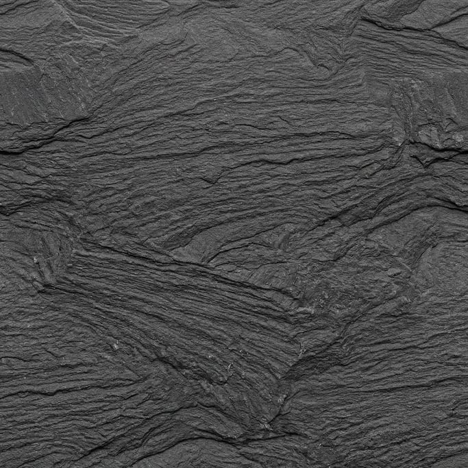 Seamless tileable texture of slate in charcoal grey in extreme close-up showing micro-detail