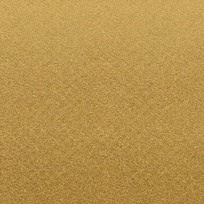 Seamless tileable texture of anodized aluminum in gold at higher magnification