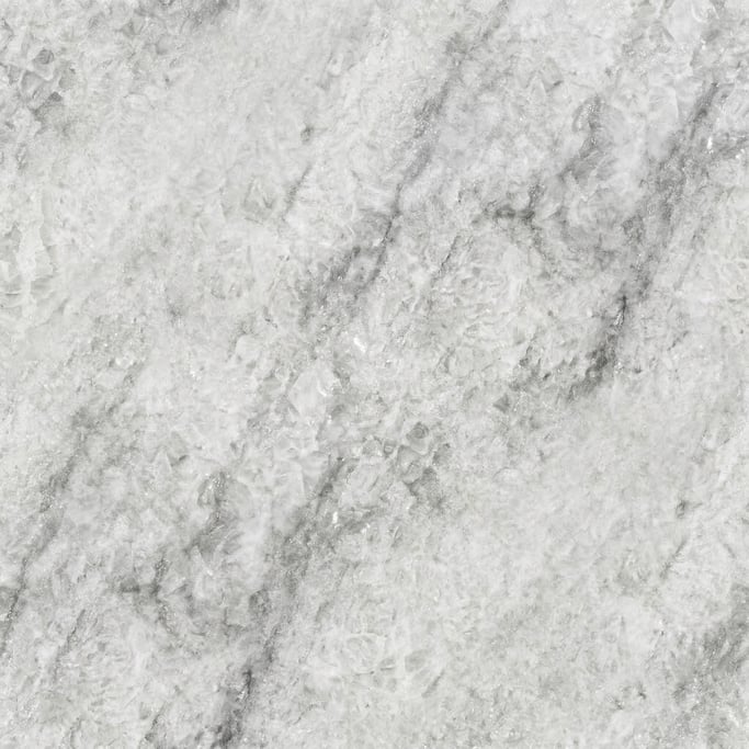 Seamless tileable texture of quartzite in white wet with water