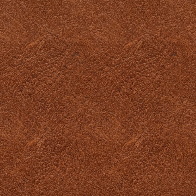 Seamless tileable texture of full-grain leather brown at higher magnification