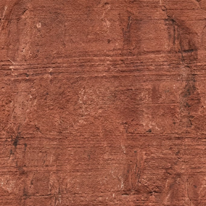 Seamless tileable texture of red sandstone heavily worn and patinated