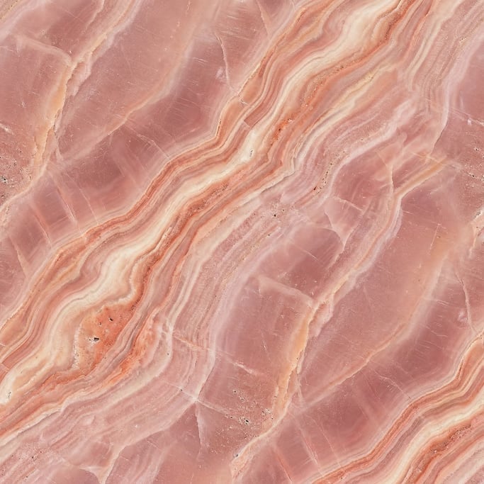 Seamless tileable texture of pink onyx lightly weathered and aged