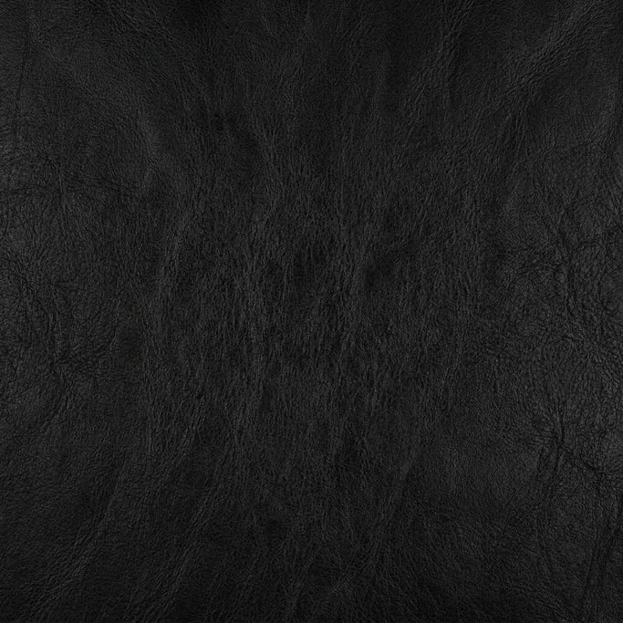 Seamless tileable texture of full-grain leather black freshly cut and raw