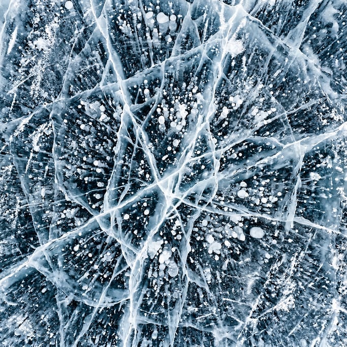 Seamless tileable texture of frozen lake surface heavily worn and patinated