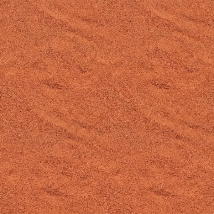 Seamless tileable texture of red desert sand at higher magnification