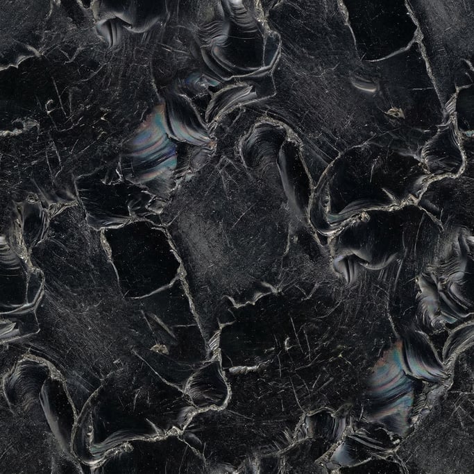 Seamless tileable texture of obsidian heavily worn and patinated