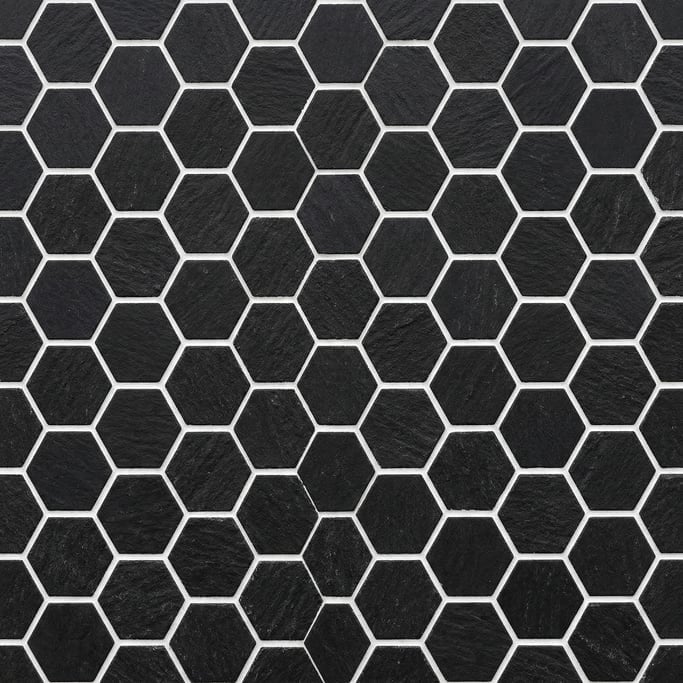 Seamless tileable texture of hexagonal tile in black freshly cut and raw