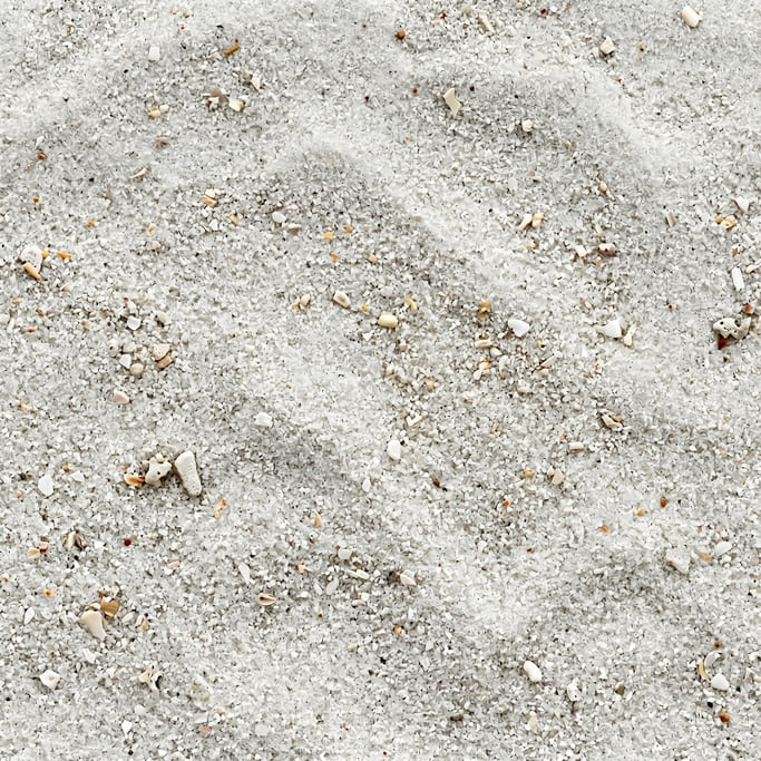 Seamless tileable texture of white beach sand in extreme close-up showing micro-detail