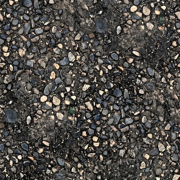 Seamless tileable texture of fresh asphalt heavily worn and patinated