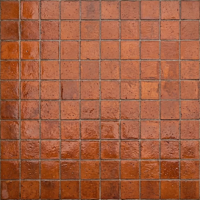 Seamless tileable texture of terracotta floor tile wet with water