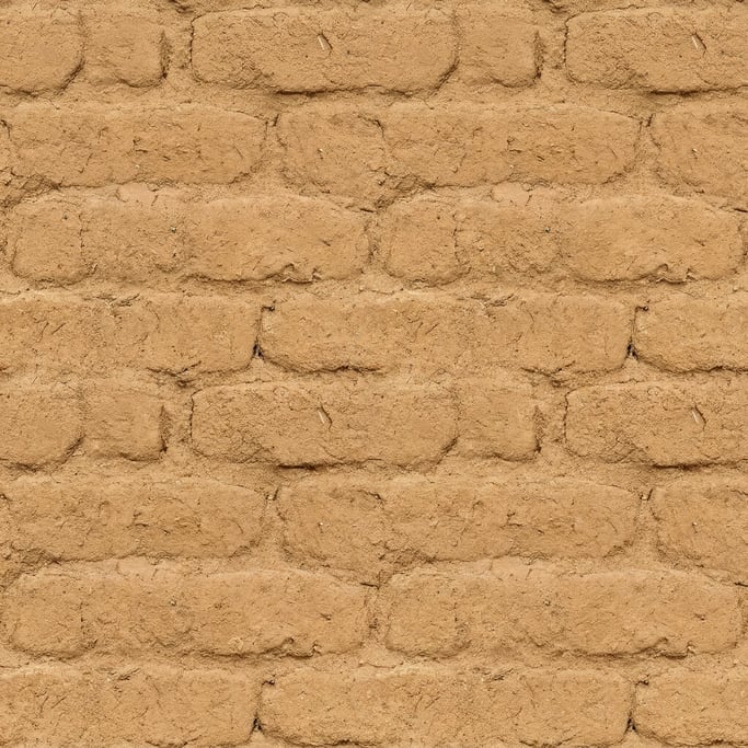 Seamless tileable texture of adobe wall lightly weathered and aged