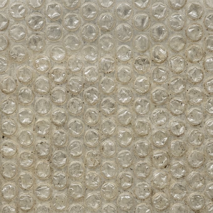 Seamless tileable texture of bubble wrap heavily worn and patinated