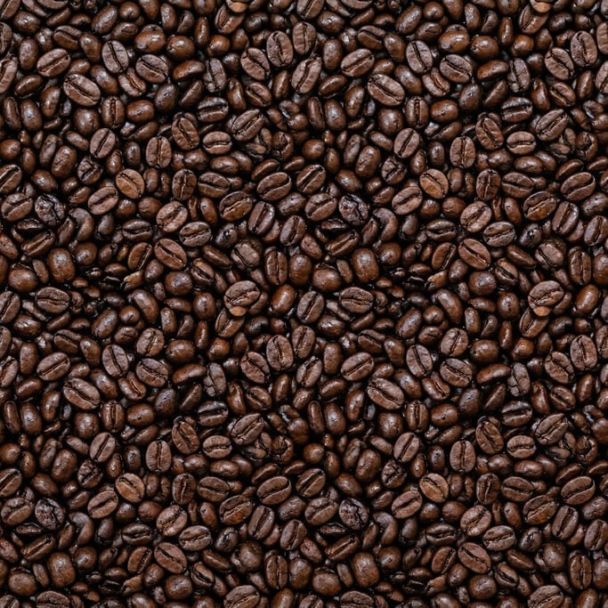 Seamless tileable texture of whole coffee beans wet with water