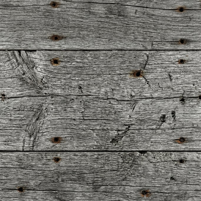Seamless tileable texture of reclaimed barn wood in extreme close-up showing micro-detail