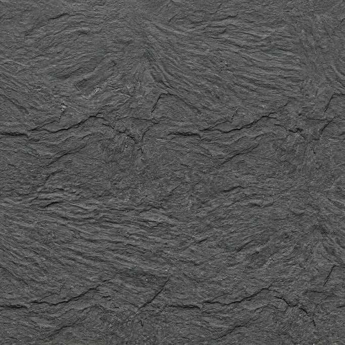 Seamless tileable texture of slate in charcoal grey in extreme close-up showing micro-detail